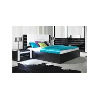 lit double 180 cm avec option coffre lina. coloris noir et blanc brillant avec une finition en simili cuir. sommier inclus