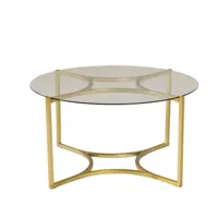 table basse élégante en métal doré avec plateau en verre